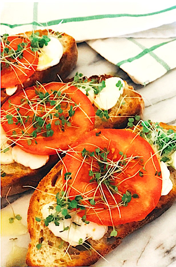 Tomato and micro arugula toasts